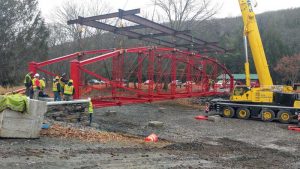 Figure 5. The restored truss is placed on the new abutments at Lazy Brook Park. Courtesy of McCormick Taylor.