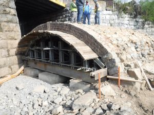 The East Burke Street Bridge arch as it is unearthed.